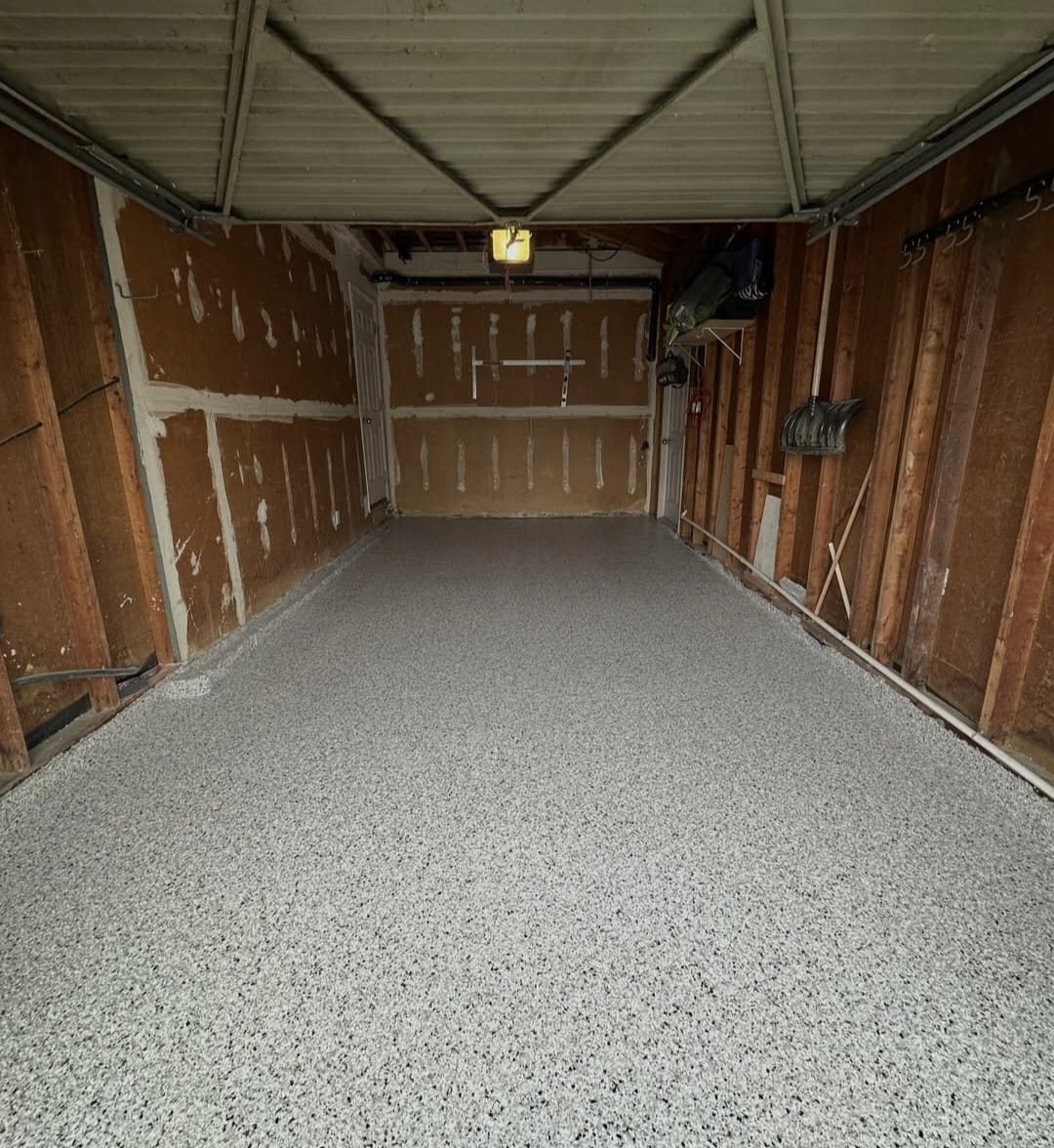 Flake epoxy garage floor, wood-wall garage